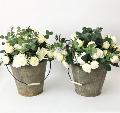 Rustic bucket with silk flowers $55.00 each