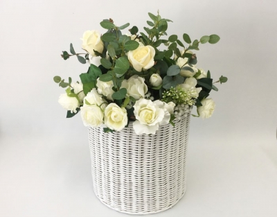 Cane basket with silk flowers $55.00 each