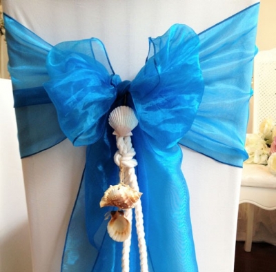 Blue organza sash with hanging shells