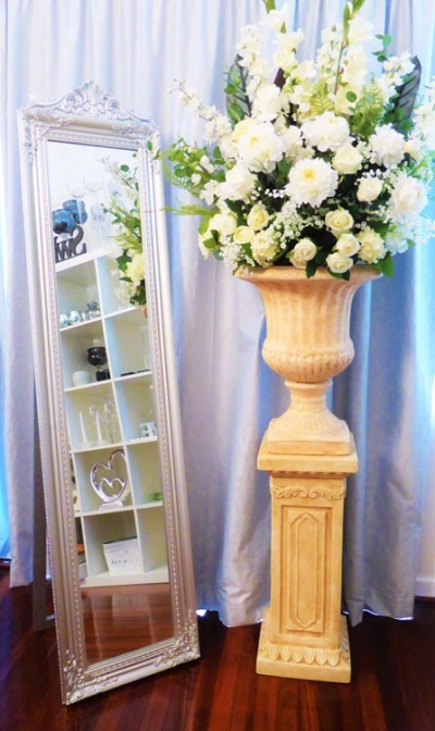 Urn and pedestal with flowers $99.00