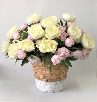 Cane basket with silk flowers P.O.A.