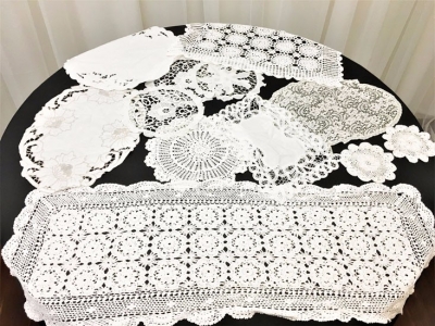 Large collection of lace and crochet doilies