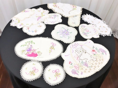 Large collection of lace and crochet doilies