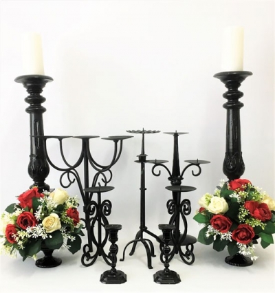Assorted black pedestal candle holders